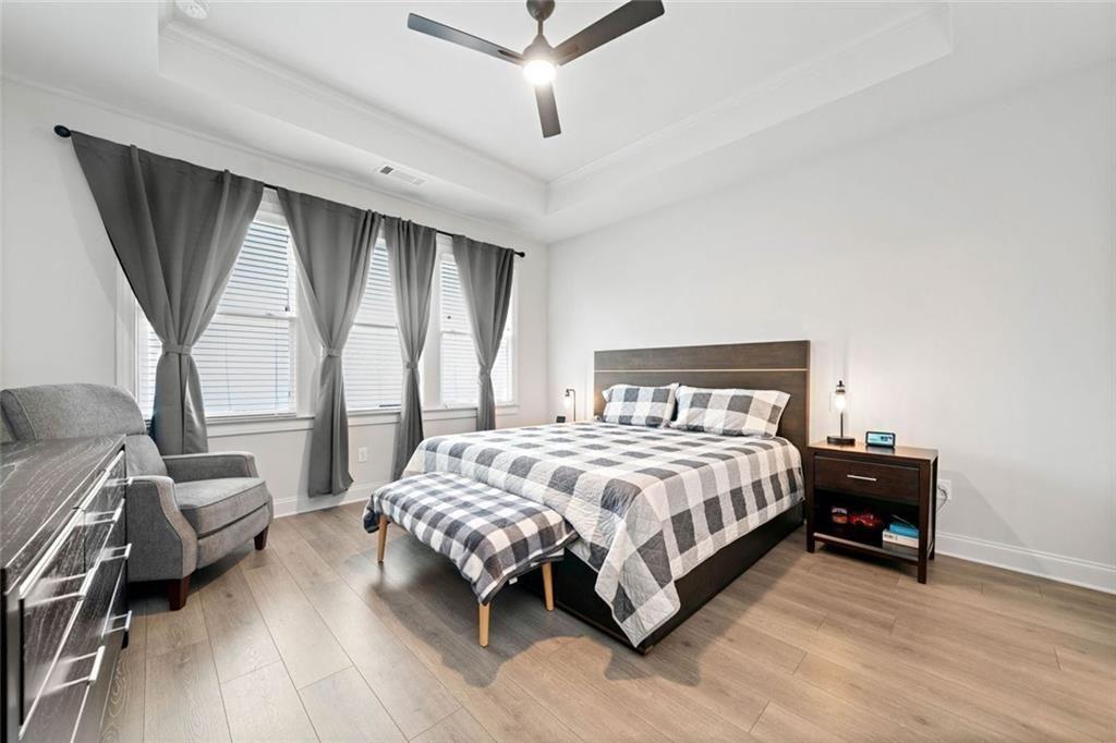 19 Grand Circle Jasper, GA 30143 - Photo 17 of 36 a bedroom with a bed next to a large window