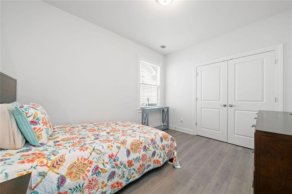 19 Grand Circle Jasper, GA 30143 - Photo 23 of 36 a bedroom with a bed and a window