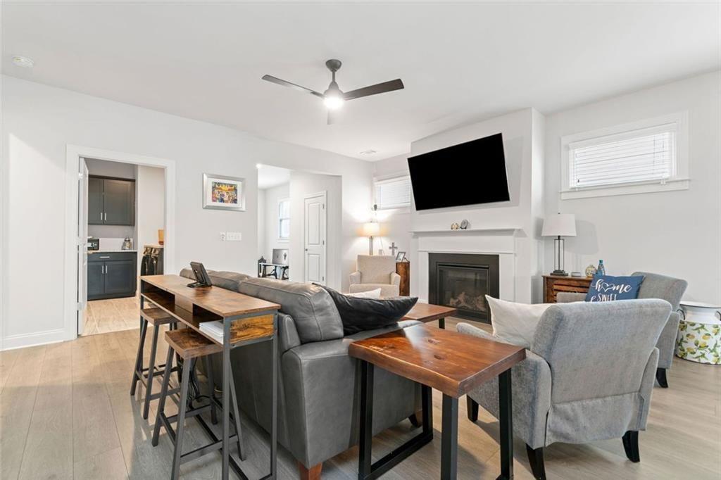19 Grand Circle Jasper, GA 30143 - Photo 7 of 36 a living room with furniture a fireplace and a flat screen tv