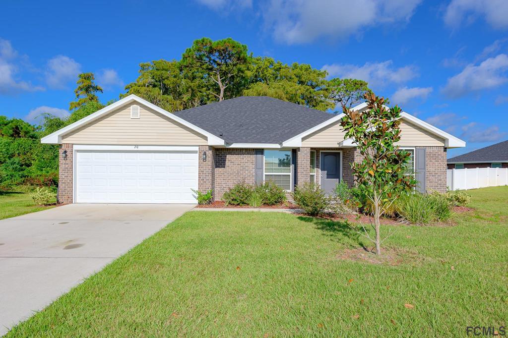 20 Turtle Ridge Drive Flagler Beach, FL 32136 - Photo 1 of 47 a view of a yard in front of a house with plants