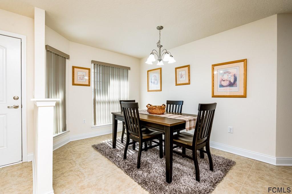 20 Turtle Ridge Drive Flagler Beach, FL 32136 - Photo 12 of 47 a view of a dining room with furniture