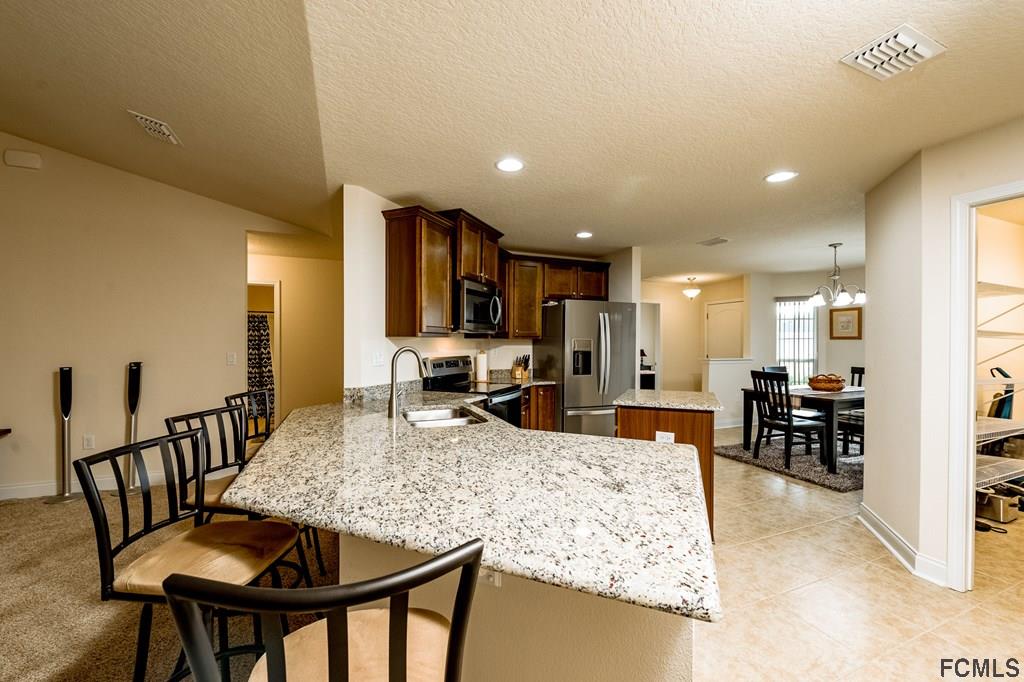 20 Turtle Ridge Drive Flagler Beach, FL 32136 - Photo 16 of 47 a view of a dining room and livingroom view