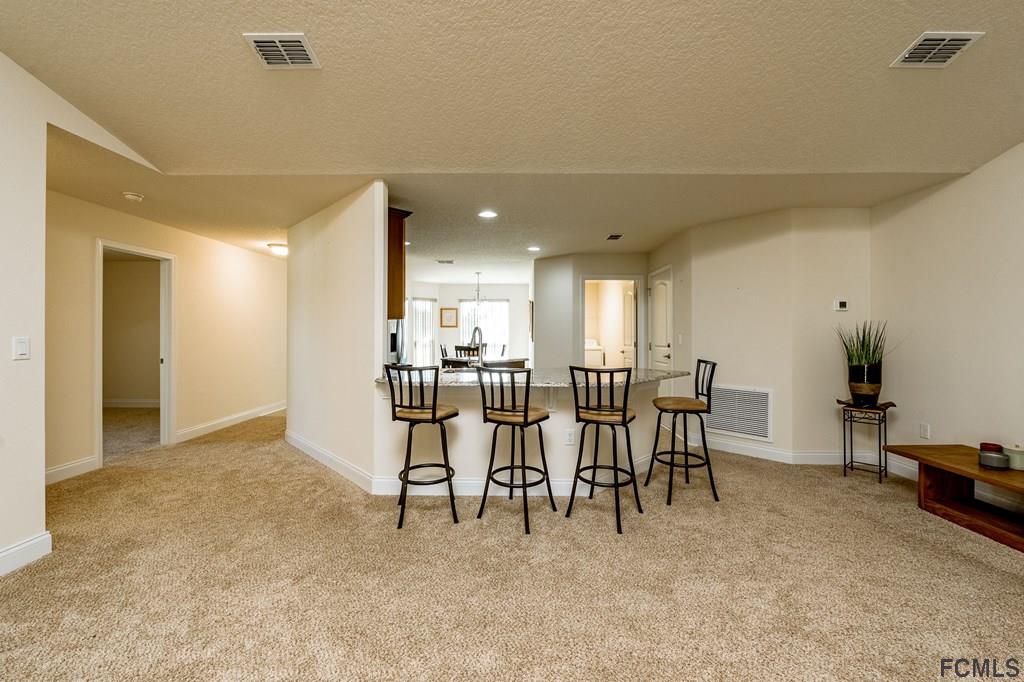 20 Turtle Ridge Drive Flagler Beach, FL 32136 - Photo 17 of 47 a view of dining room with furniture and kitchen view