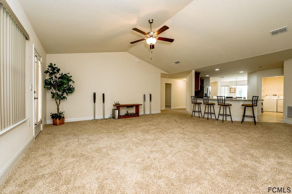 20 Turtle Ridge Drive Flagler Beach, FL 32136 - Photo 18 of 47 a view of a livingroom with a staircase