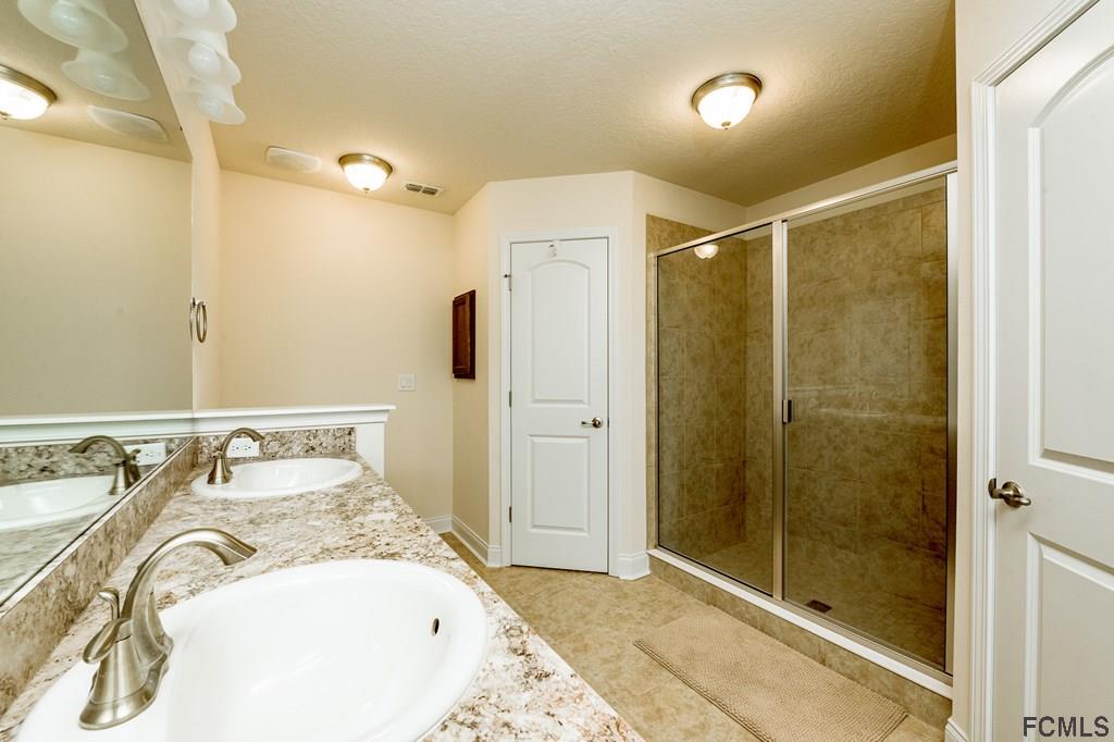 20 Turtle Ridge Drive Flagler Beach, FL 32136 - Photo 23 of 47 a bathroom with a sink and a mirror