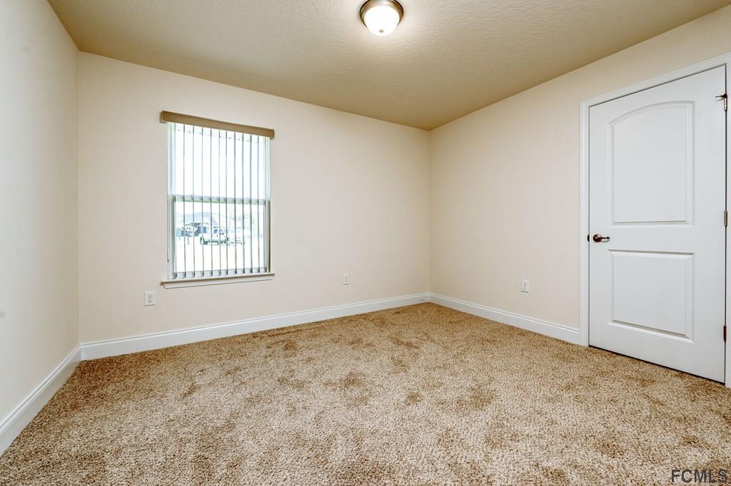 20 Turtle Ridge Drive Flagler Beach, FL 32136 - Photo 28 of 47 an empty room with a window