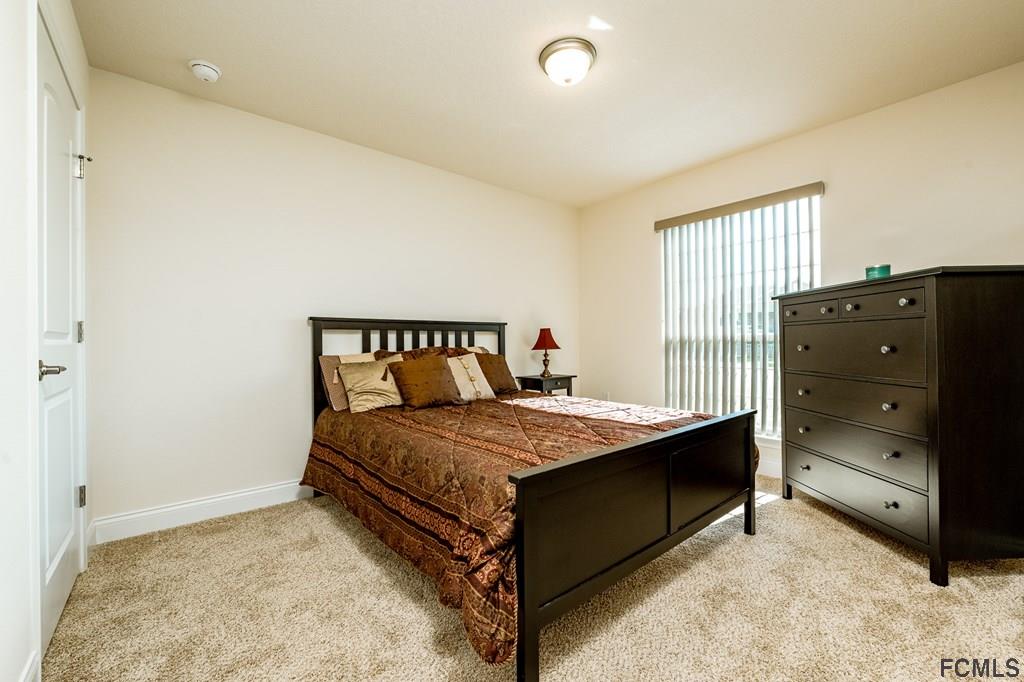 20 Turtle Ridge Drive Flagler Beach, FL 32136 - Photo 29 of 47 a bedroom with a bed and a window