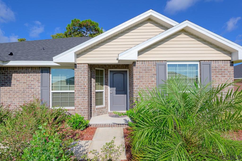 20 Turtle Ridge Drive Flagler Beach, FL 32136 - Photo 4 of 47 a view of a white house next to a yard