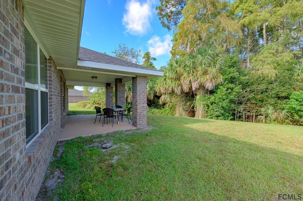20 Turtle Ridge Drive Flagler Beach, FL 32136 - Photo 5 of 47 a house view with a garden space
