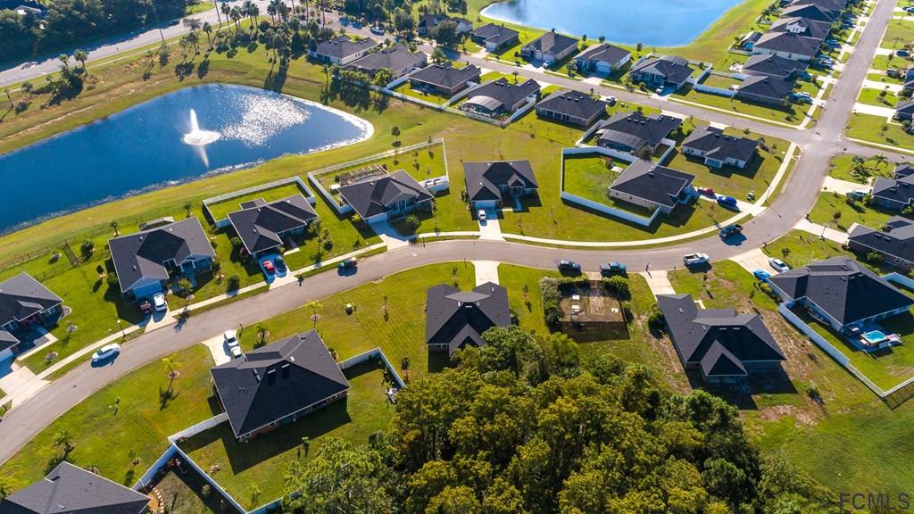 20 Turtle Ridge Drive Flagler Beach, FL 32136 - Photo 42 of 47 an aerial view of a pool patio fire pit and outdoor kitchen