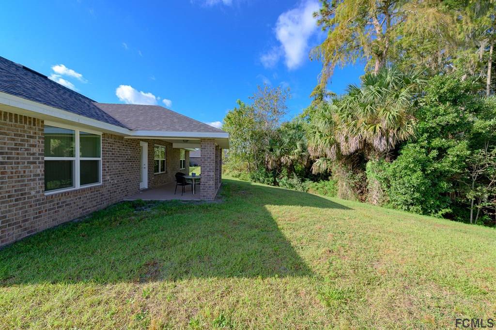 20 Turtle Ridge Drive Flagler Beach, FL 32136 - Photo 7 of 47 a view of a house with a yard