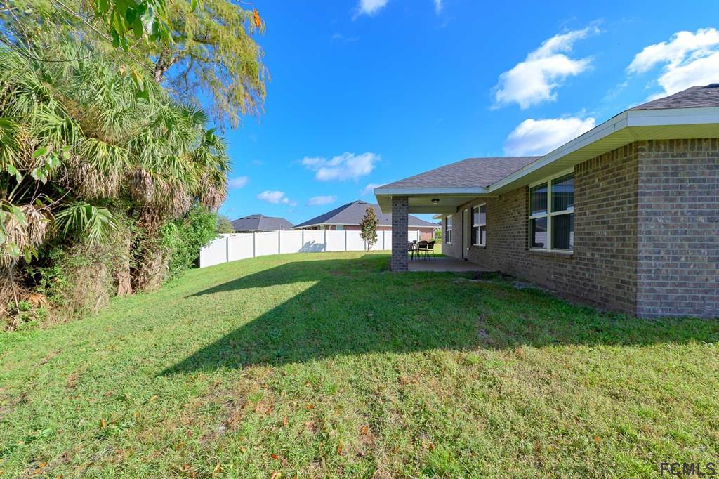 20 Turtle Ridge Drive Flagler Beach, FL 32136 - Photo 9 of 47 a view of a house with a yard