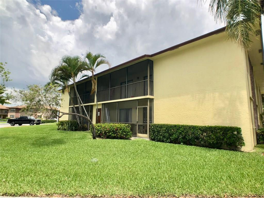 10026 Winding Lake Road, Unit 102 Sunrise, FL 33351 - Photo 2 of 23 a view of a backyard
