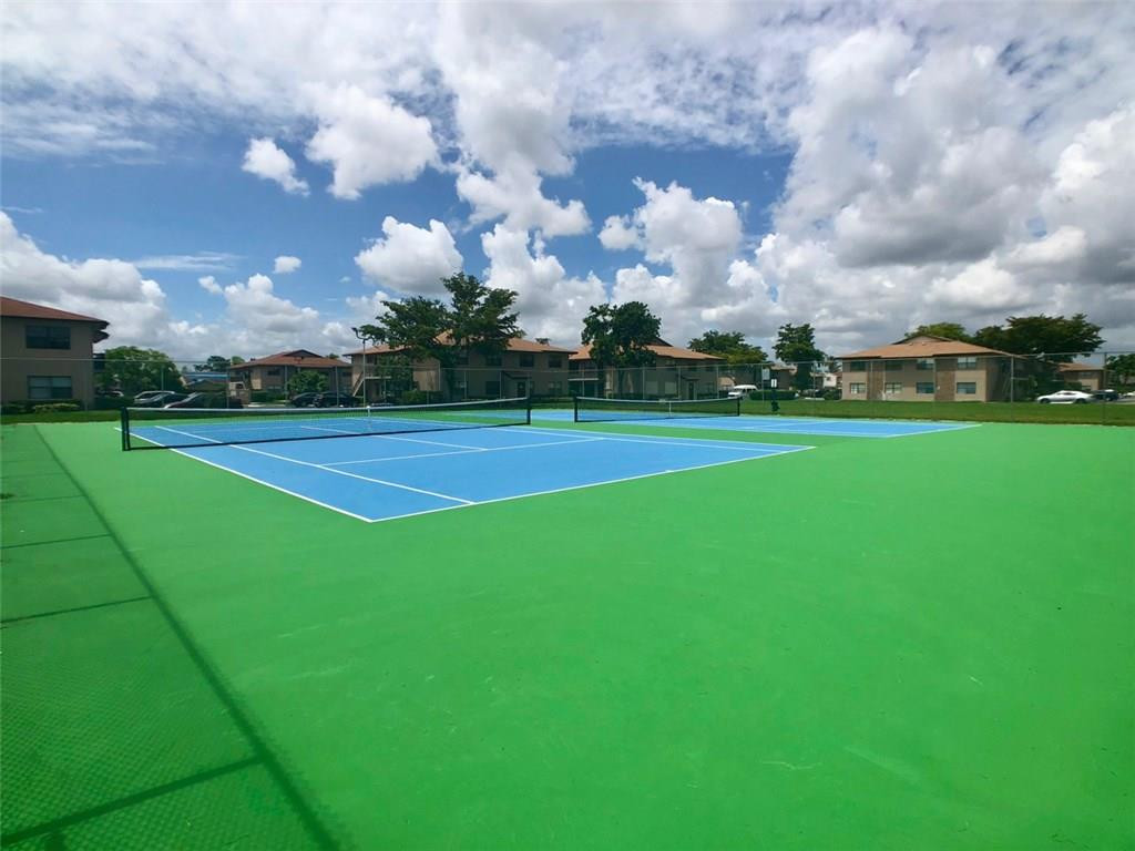 10026 Winding Lake Road, Unit 102 Sunrise, FL 33351 - Photo 23 of 23 a view of a golf course with a lake