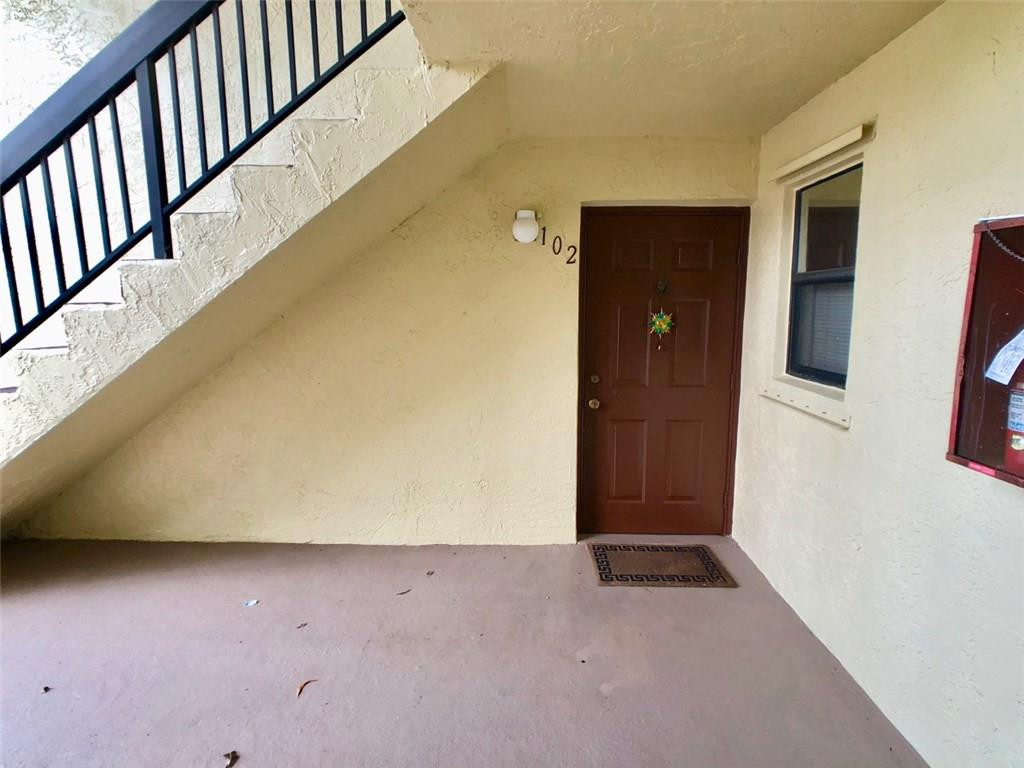 10026 Winding Lake Road, Unit 102 Sunrise, FL 33351 - Photo 3 of 23 a view of an empty room with wooden floor