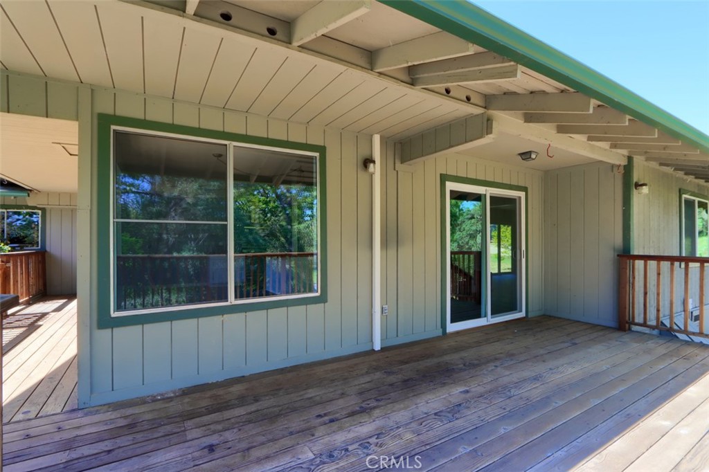 4949 Indian Peak Road Mariposa, CA 95338 - Photo 12 of 56 a view of an empty room with wooden floor and windows