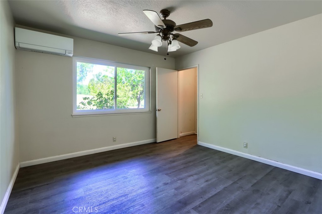 4949 Indian Peak Road Mariposa, CA 95338 - Photo 20 of 56 a view of an empty room with wooden floor and a window