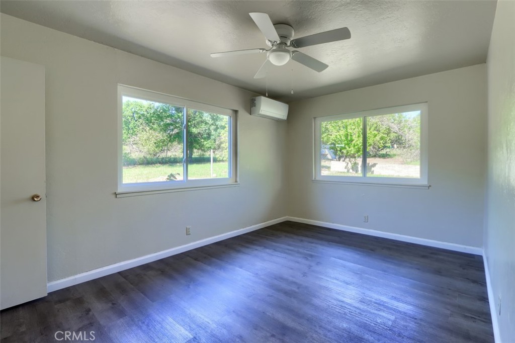 4949 Indian Peak Road Mariposa, CA 95338 - Photo 23 of 56 a view of an empty room with wooden floor and a window