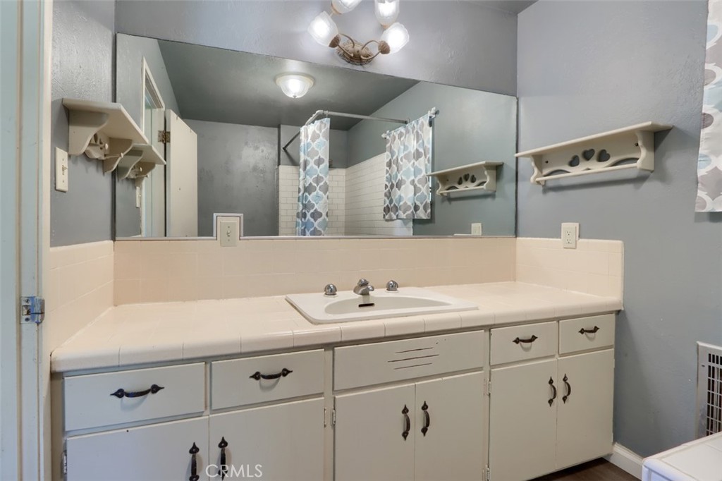 4949 Indian Peak Road Mariposa, CA 95338 - Photo 28 of 56 a bathroom with a sink double vanity and a mirror