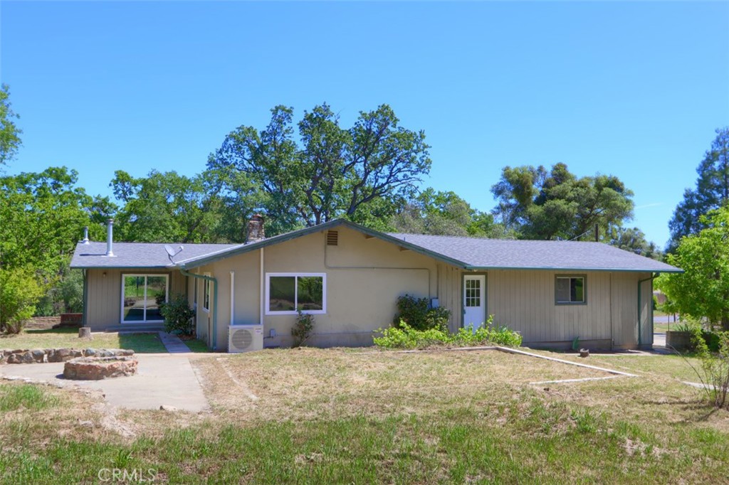 4949 Indian Peak Road Mariposa, CA 95338 - Photo 40 of 56 a front view of a house with a garden