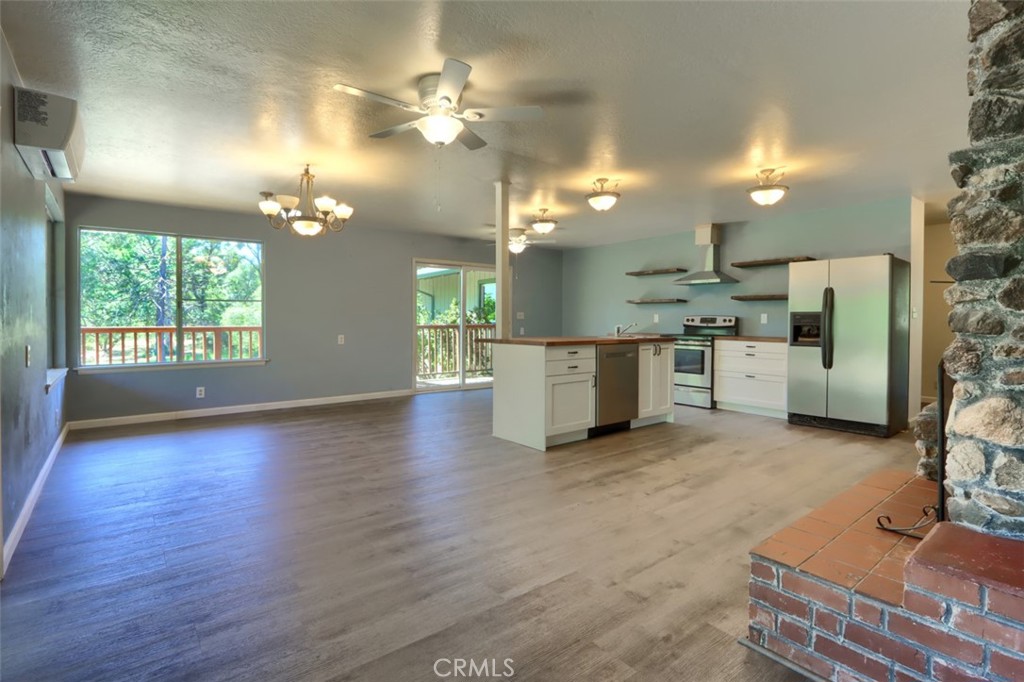 4949 Indian Peak Road Mariposa, CA 95338 - Photo 4 of 56 a view of a kitchen with a sink and a refrigerator