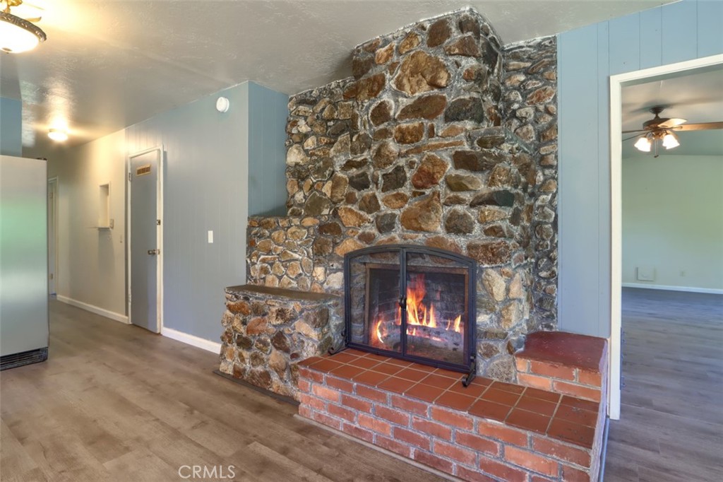 4949 Indian Peak Road Mariposa, CA 95338 - Photo 5 of 56 a living room with a fireplace and a fireplace
