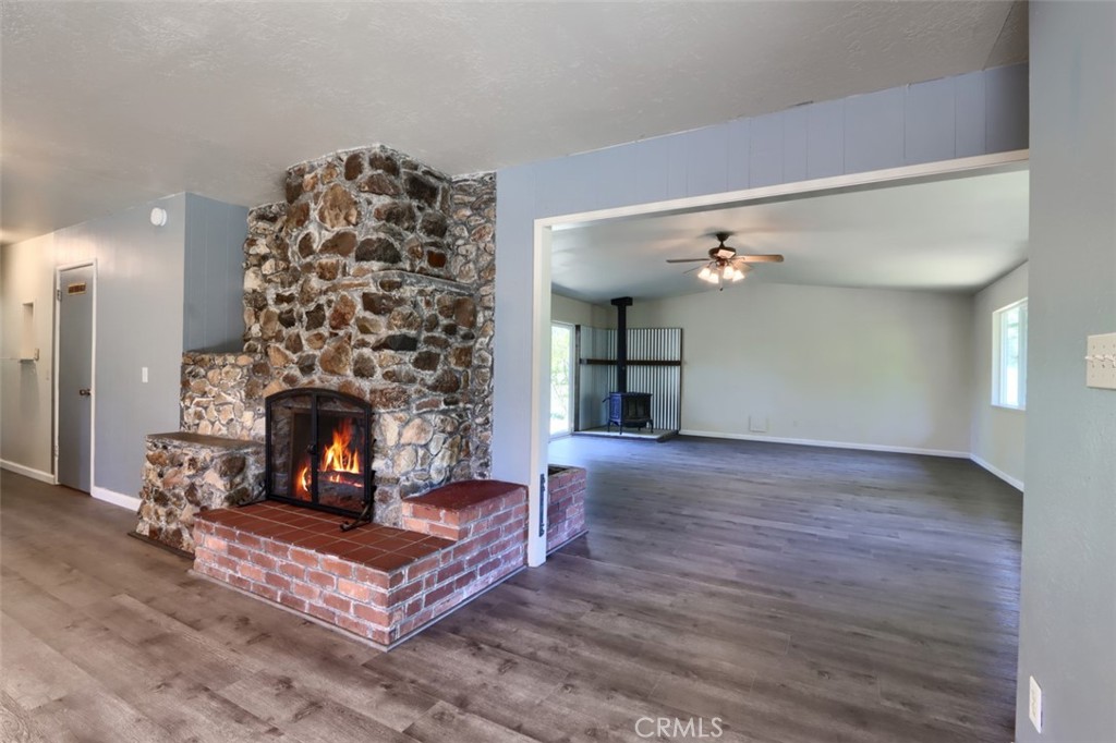 4949 Indian Peak Road Mariposa, CA 95338 - Photo 6 of 56 a living room with furniture and a fireplace