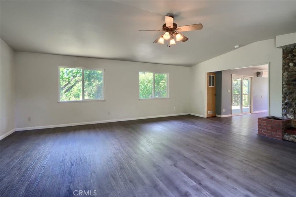 4949 Indian Peak Road Mariposa, CA 95338 - Photo 8 of 56 a view of an empty room with wooden floor and a window