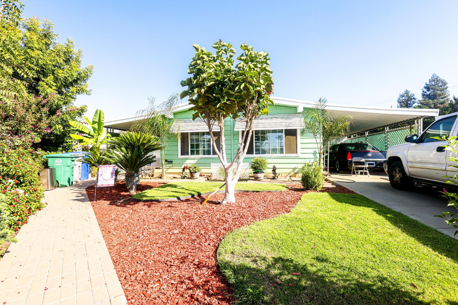 1300 West Olson Avenue, Unit 61 Reedley, CA 93654 - Photo 1 of 20 a house view with a sitting space