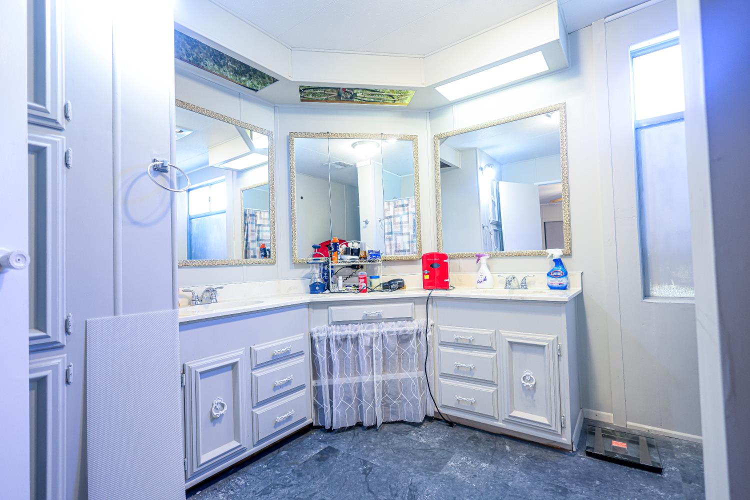 1300 West Olson Avenue, Unit 61 Reedley, CA 93654 - Photo 15 of 20 a bathroom with a sink vanity and mirror