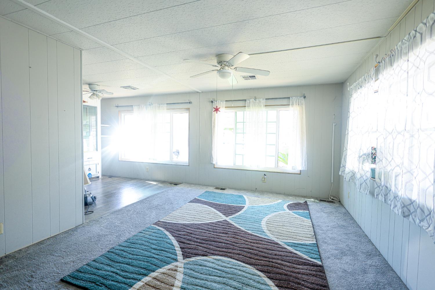 1300 West Olson Avenue, Unit 61 Reedley, CA 93654 - Photo 4 of 20 a spacious bedroom with a bed and a window