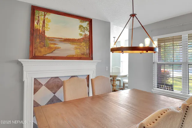 a view of a livingroom with furniture and window