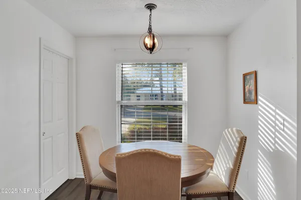 a view of a dining room with furniture window and outside view