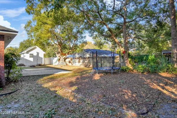 a view of house with outdoor space and sitting area