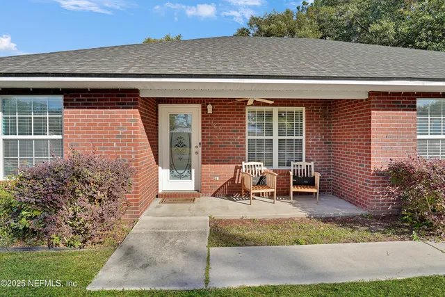 a view of house with outdoor seating area