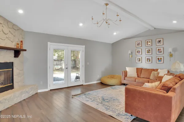 a living room with furniture and a fireplace