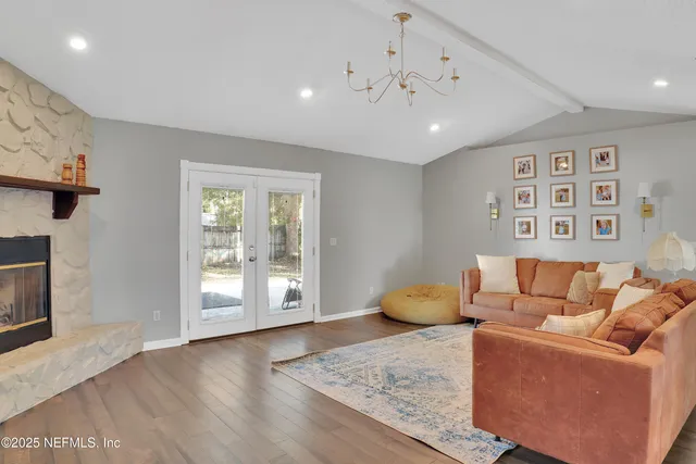 a living room with furniture and a fireplace
