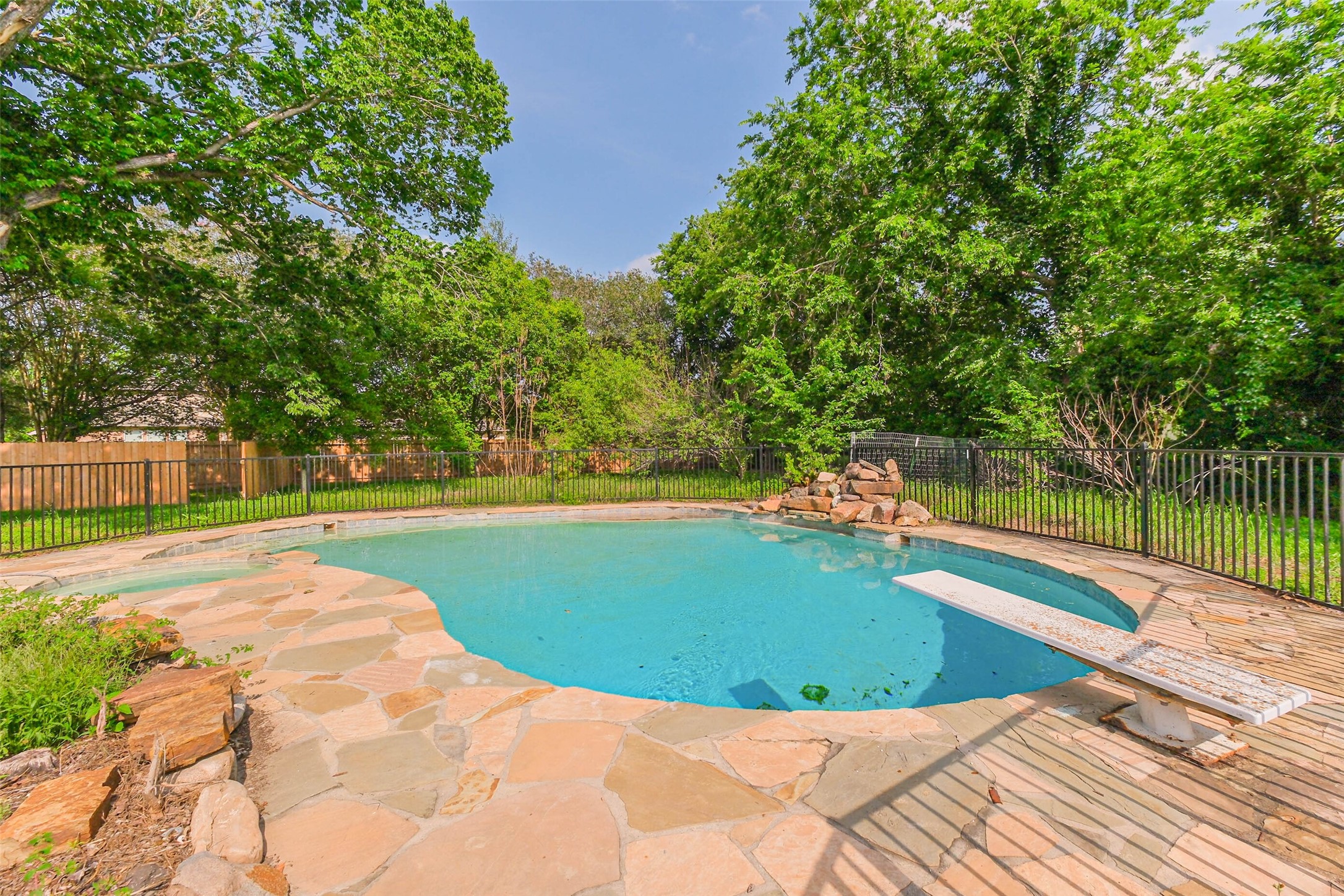 11019 Clodine Road Sugar Land, TX 77498 - Photo 33 of 39 a view of a swimming pool with a patio