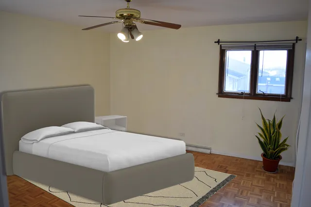 a bedroom with a bed and a window