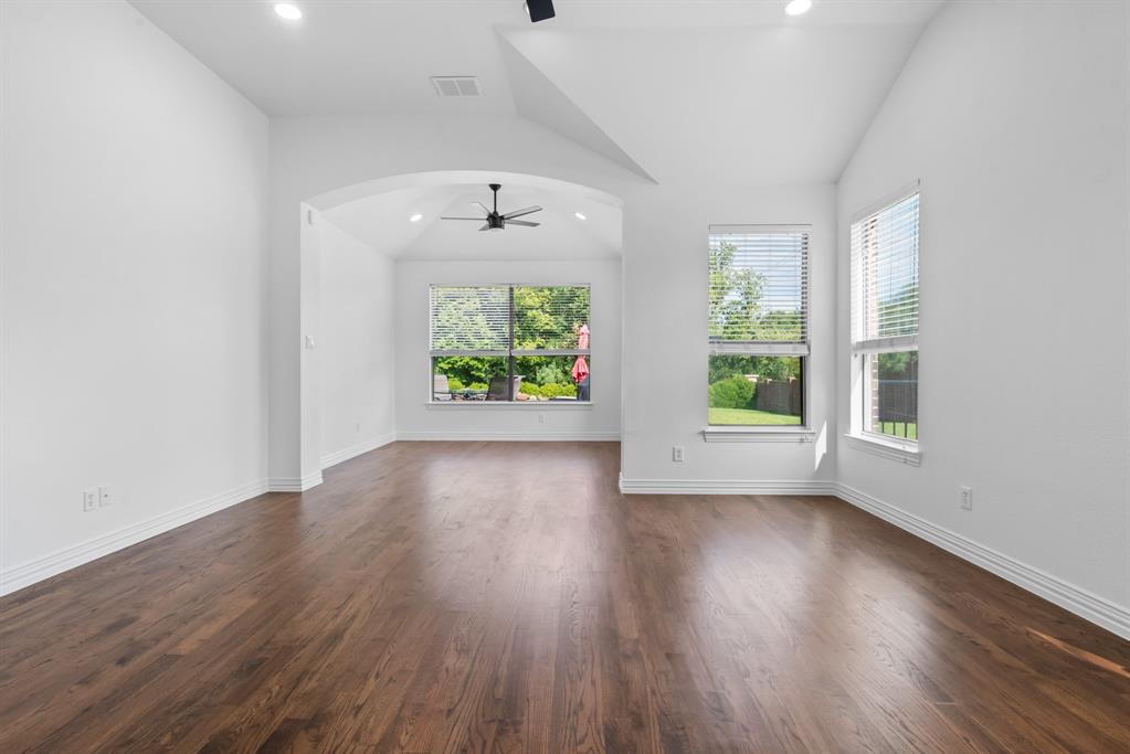 1013 Siena Drive Southlake, TX 76092 - Photo 19 of 31 an empty room with wooden floor and windows