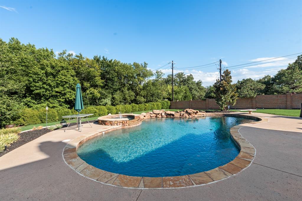 1013 Siena Drive Southlake, TX 76092 - Photo 31 of 31 a view of a swimming pool with a yard