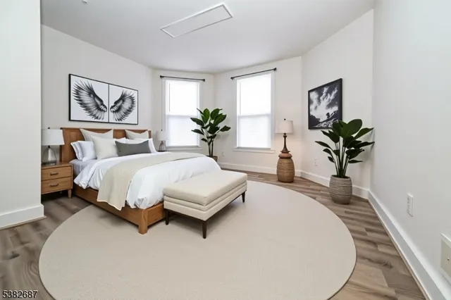 a bedroom with bed and a couch