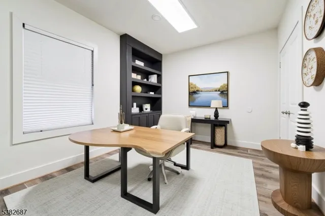 a workspace with furniture and a window