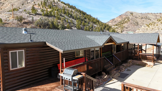 7500 Spring Canyon Road Helper, UT 84526 - Photo 5 of 83 Back of house with a shingled roof and a deck with mountain view
