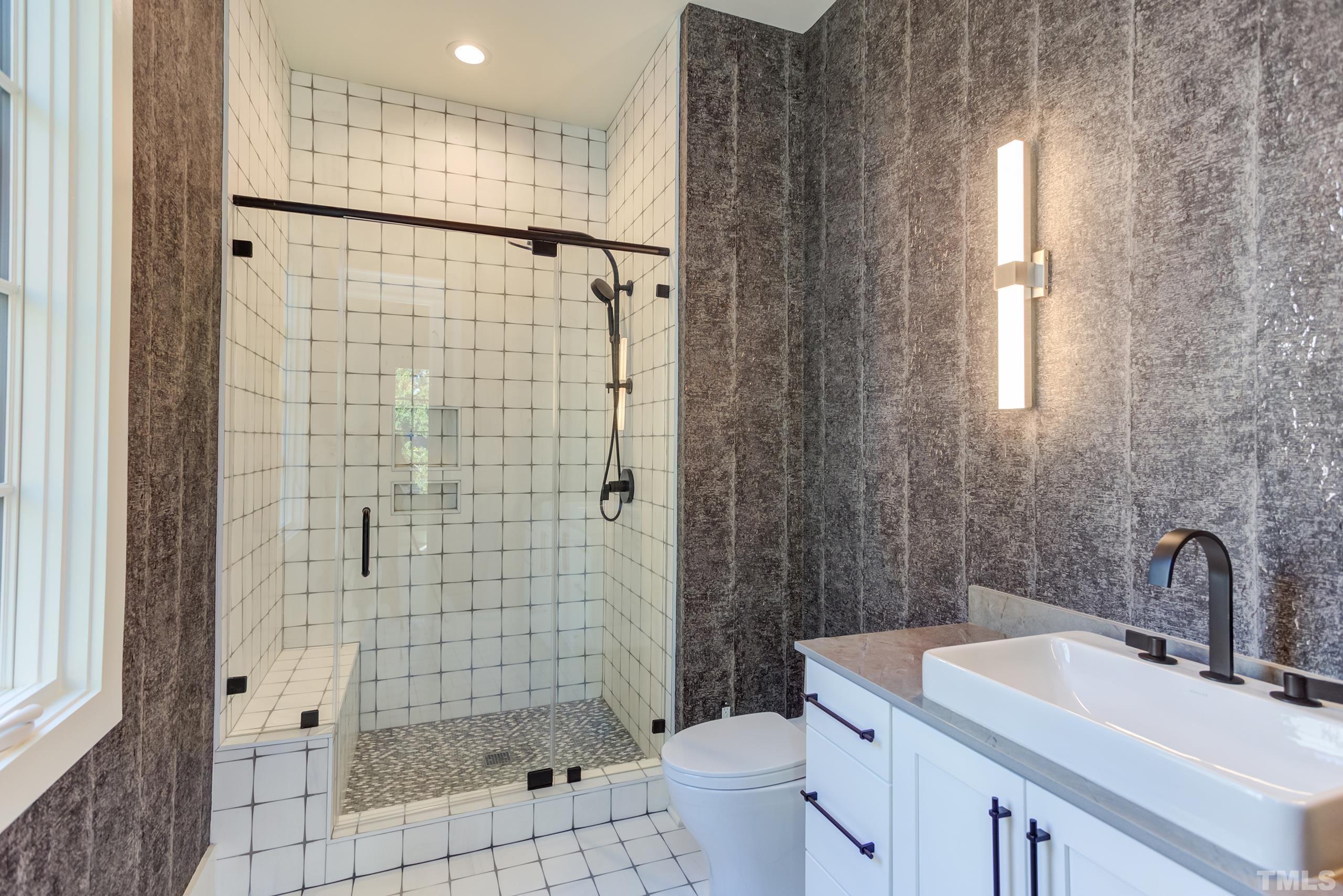 622 Shelley Road Raleigh, NC 27609 - Photo 22 of 26 a bathroom with a sink toilet and shower