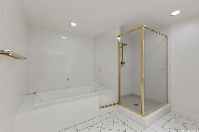 a bathroom with a shower and a bath tub