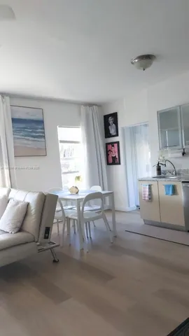 a living room with furniture and window