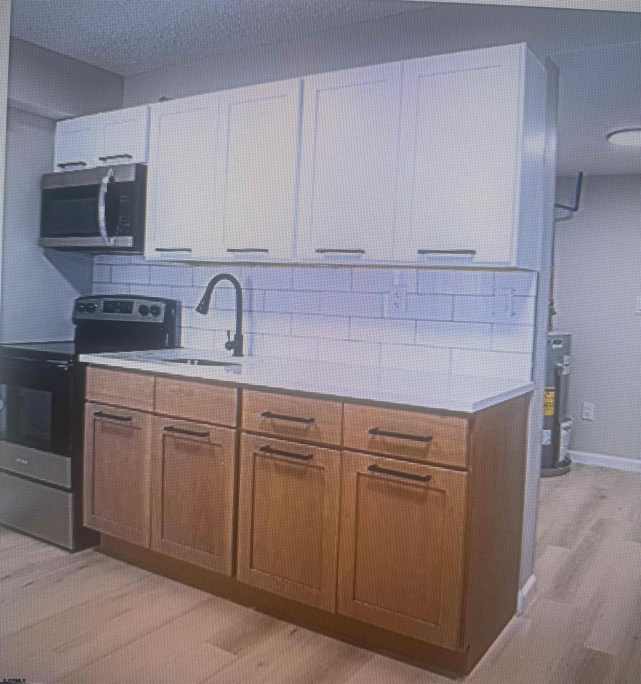 2580 Tilton Road, Unit 34 Egg Harbor Township, NJ 08234 - Photo 6 of 12 a kitchen with cabinets stainless steel appliances and sink