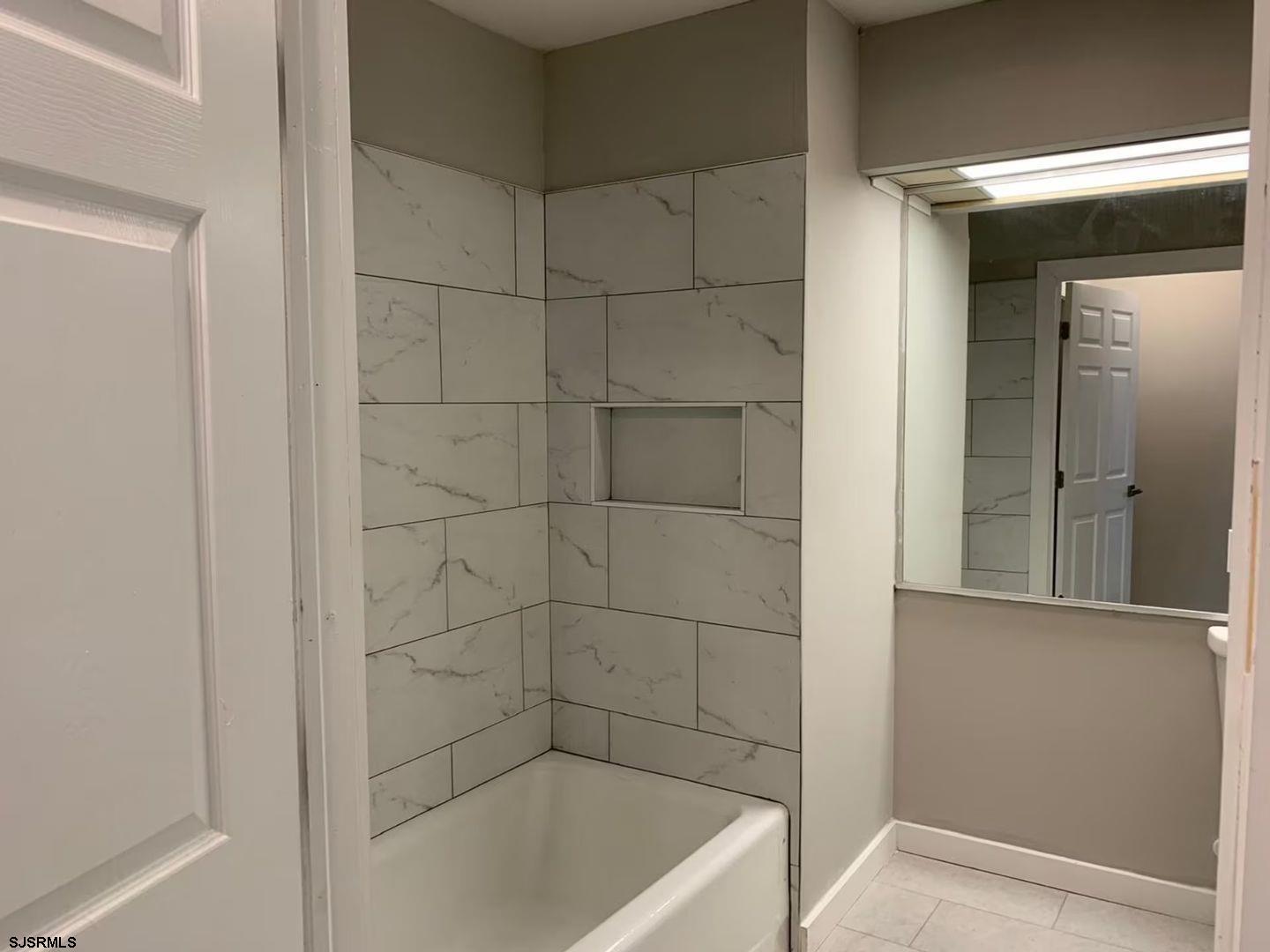 2580 Tilton Road, Unit 34 Egg Harbor Township, NJ 08234 - Photo 8 of 12 a bathroom with a bathtub