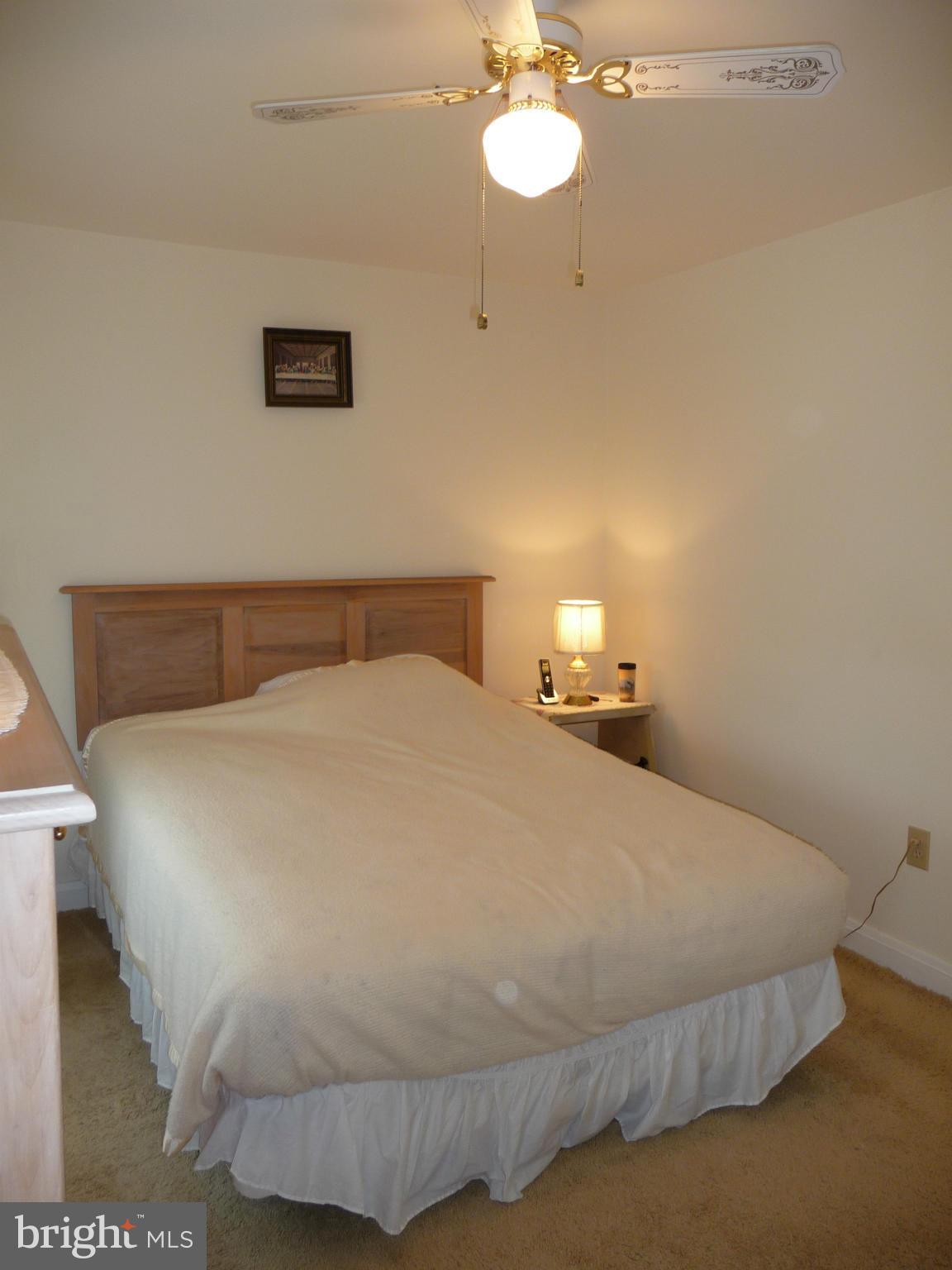 1751 Amuskai Road Baltimore, MD 21234 - Photo 11 of 27 a bedroom with a bed and painting on the wall